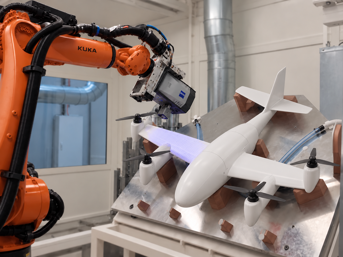 Industrial robotic arm performing precision inspection on a fixed-wing drone airframe